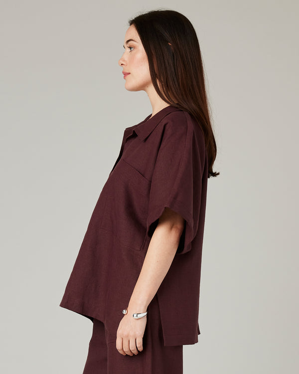 model wears burgundy linen cara shirt