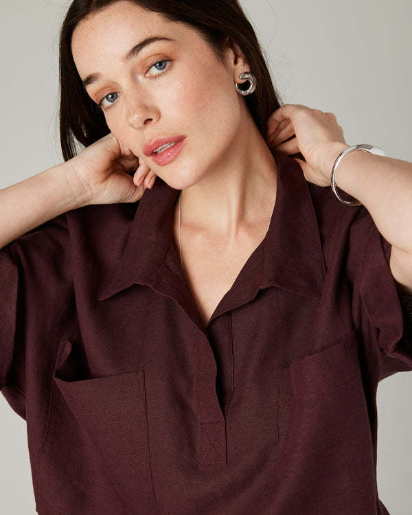 model wears burgundy linen cara shirt