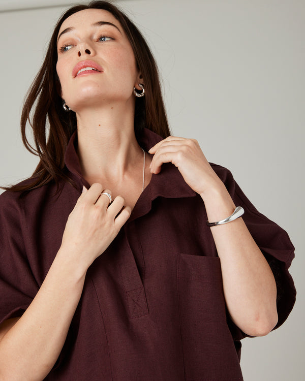 model wears burgundy linen cara shirt