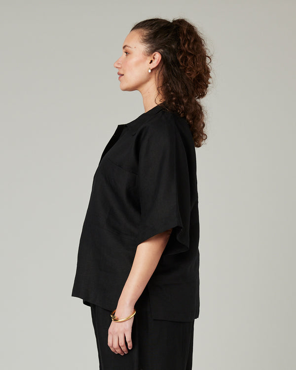 pregnant model wears black linen cara shirt 