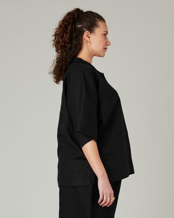pregnant model wears black linen cara shirt 