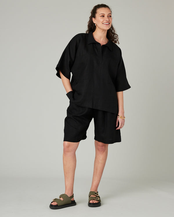 pregnant model wears black linen cara shirt 