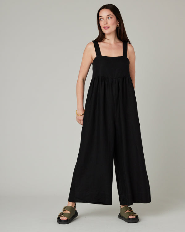 model wears black cari linen jumpsuit