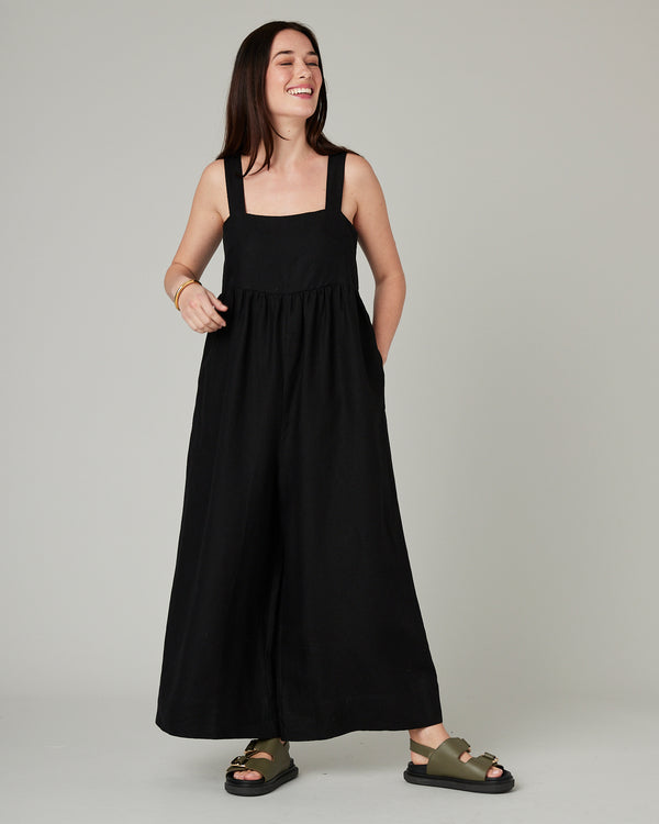 model wears black cari linen jumpsuit