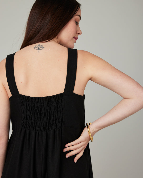 model wears black cari linen jumpsuit