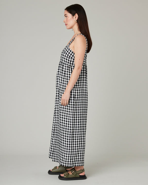 model wears black and white gingham cari linen jumpsuit