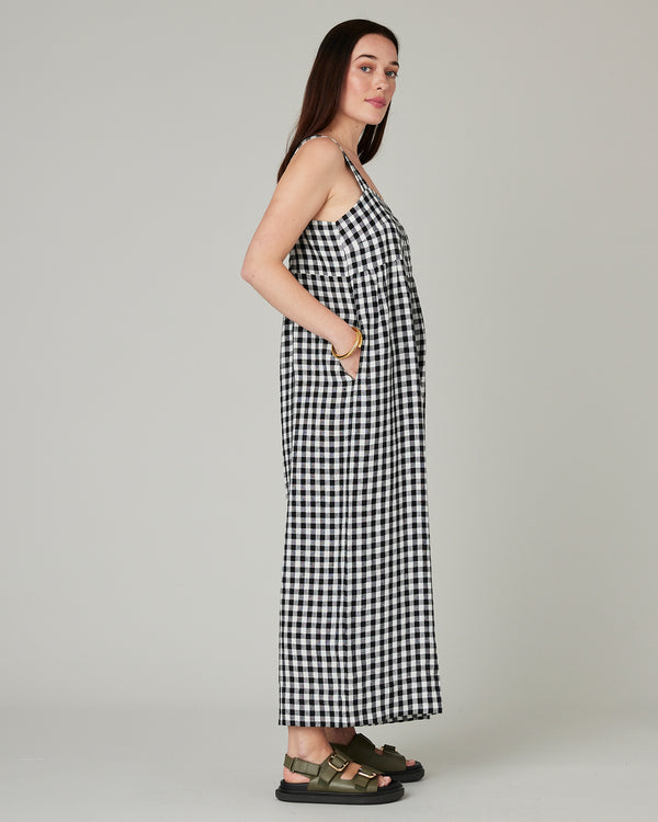 model wears black and white gingham cari linen jumpsuit