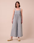 model wears cari aloe stripe linen jumpsuit