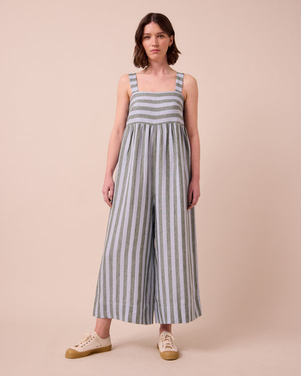 model wears cari aloe stripe linen jumpsuit