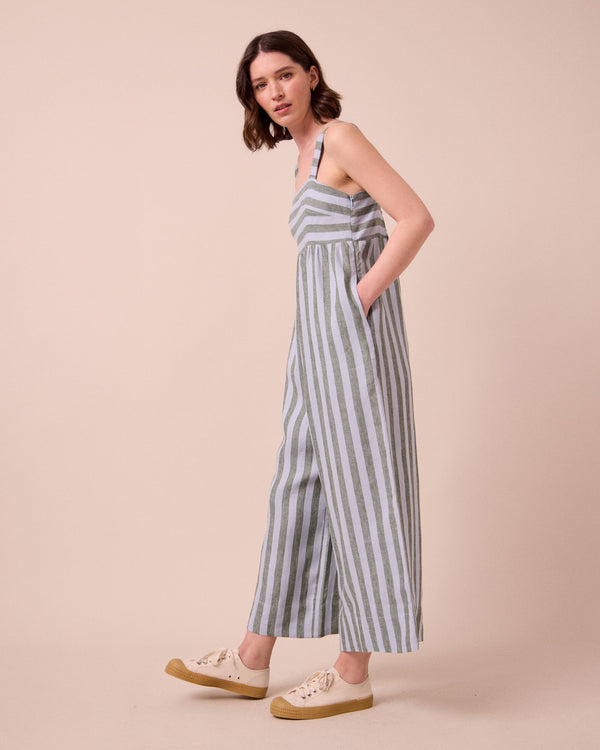 model wears cari aloe stripe linen jumpsuit