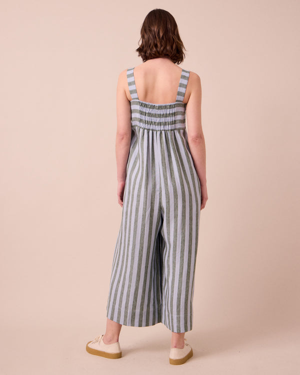 model wears cari aloe stripe linen jumpsuit