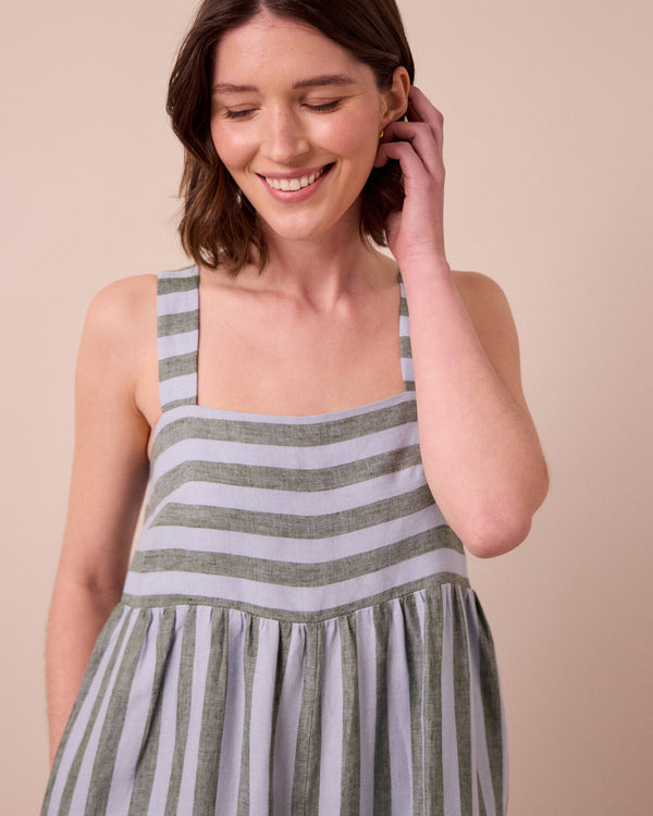 model wears cari aloe stripe linen jumpsuit