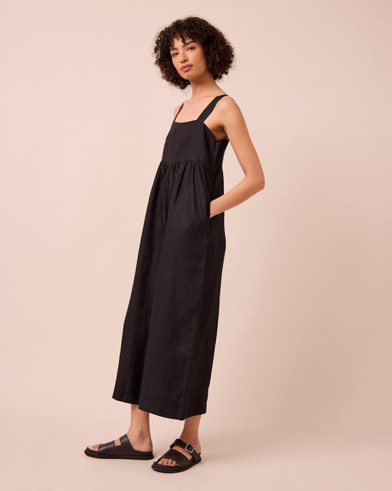 model wears cari black linen jumpsuit