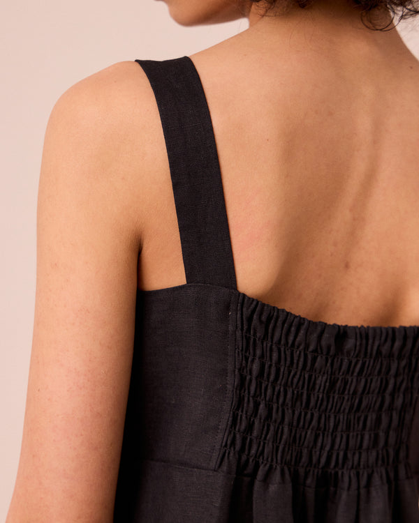 model wears cari black linen jumpsuit