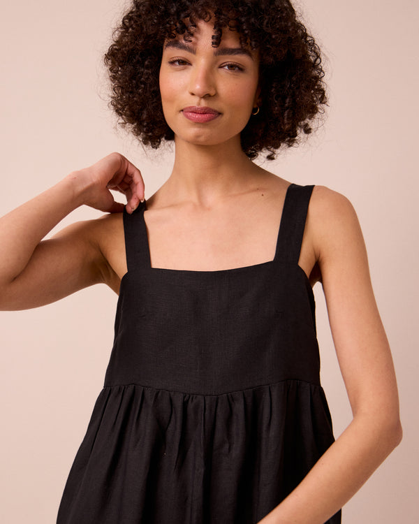 model wears cari black linen jumpsuit