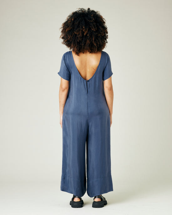 pregnant model wears blue cupro celine jumpsuit