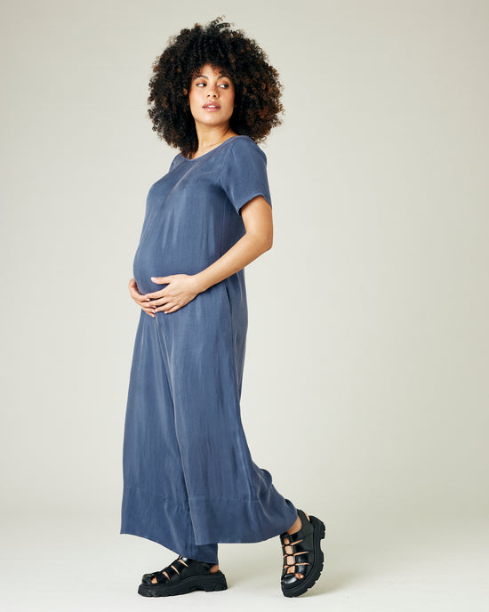 pregnant model wears blue cupro celine jumpsuit