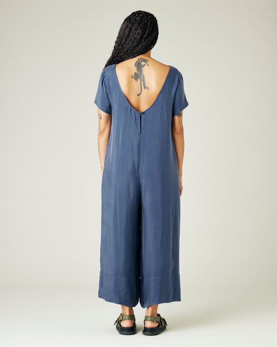 model wears blue cupro celine jumpsuit