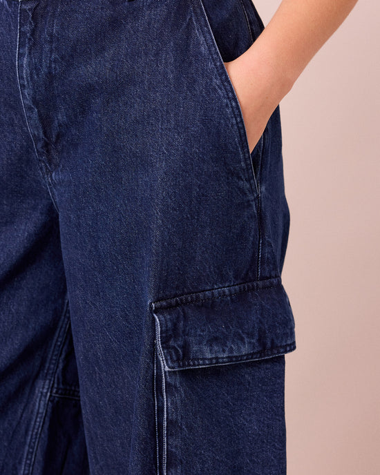 model wears claudie dark blue denim jeans