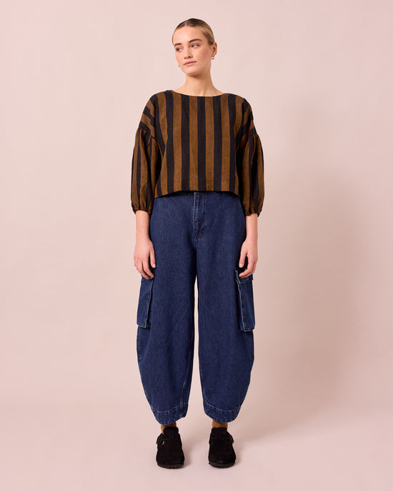 model wears claudie dark blue denim jeans right