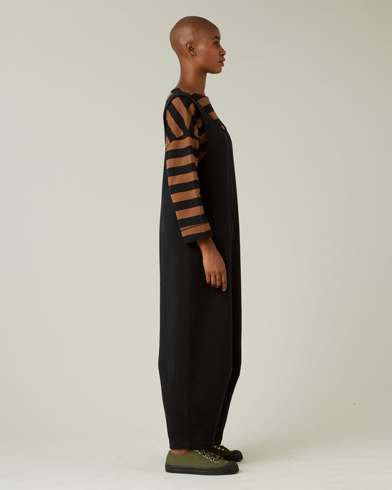 model wears black jersey clover jumpsuit