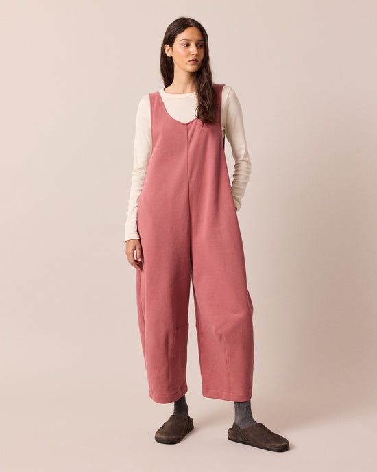 model wears clover dusty pink jersey jumpsuit