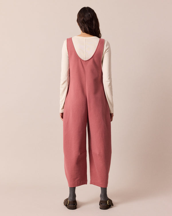 model wears clover dusty pink jersey jumpsuit