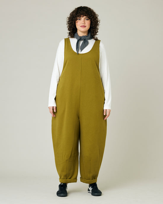 model wears golden olive jersey clover jumpsuit