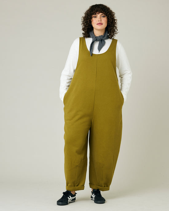 model wears golden olive jersey clover jumpsuit