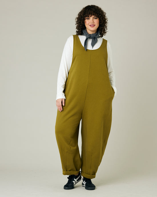 model wears golden olive jersey clover jumpsuit