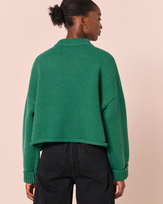 model wears coco emerald knitted jumper