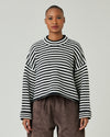 model wears black and ivory stripe coco