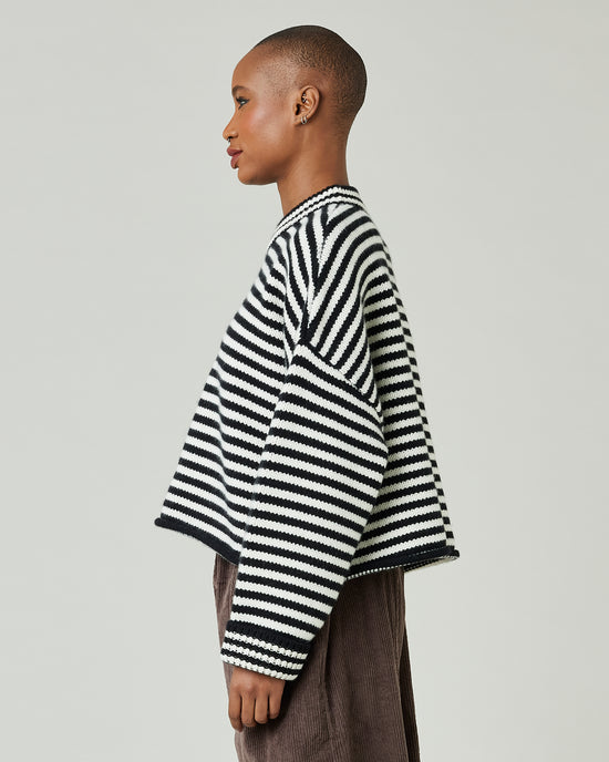 model wears black and ivory stripe coco