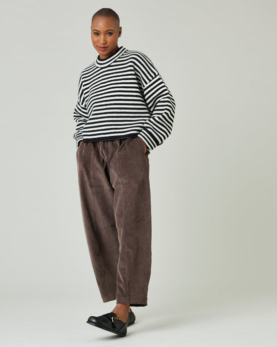 model wears black and ivory stripe coco