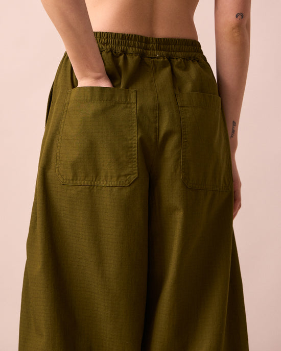 model wears codi dark olive textured cotton trousers detail
