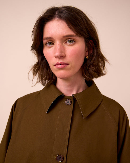 model wears collette hazel trench coat