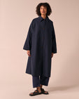 model wears collette navy coated cotton trench coat