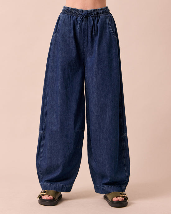 model wears cora dark wash denim jeans front