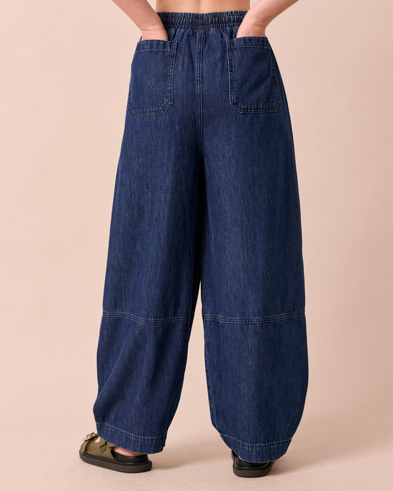 model wears cora dark wash denim jeans back