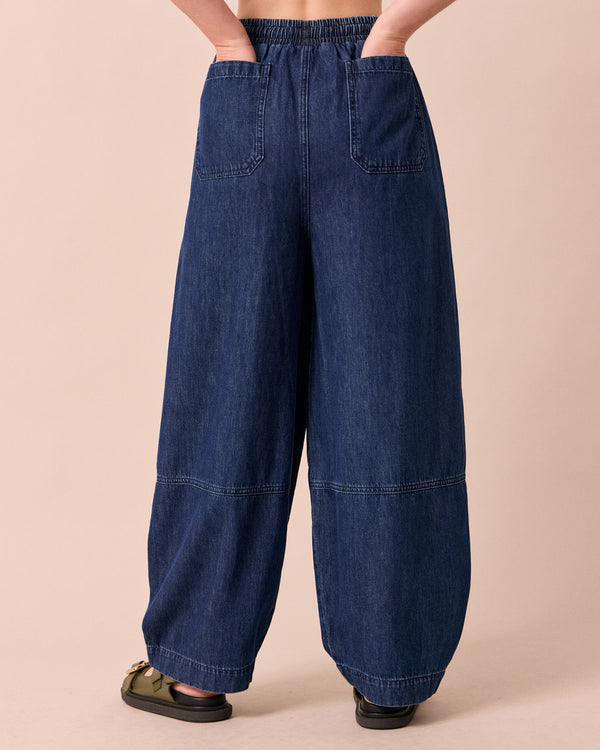 model wears cora dark wash denim jeans back