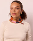 model wears neckerchief sunset harlequin neckerchief