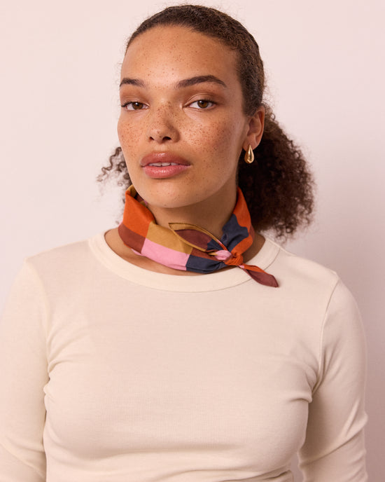 model wears neckerchief sunset harlequin neckerchief