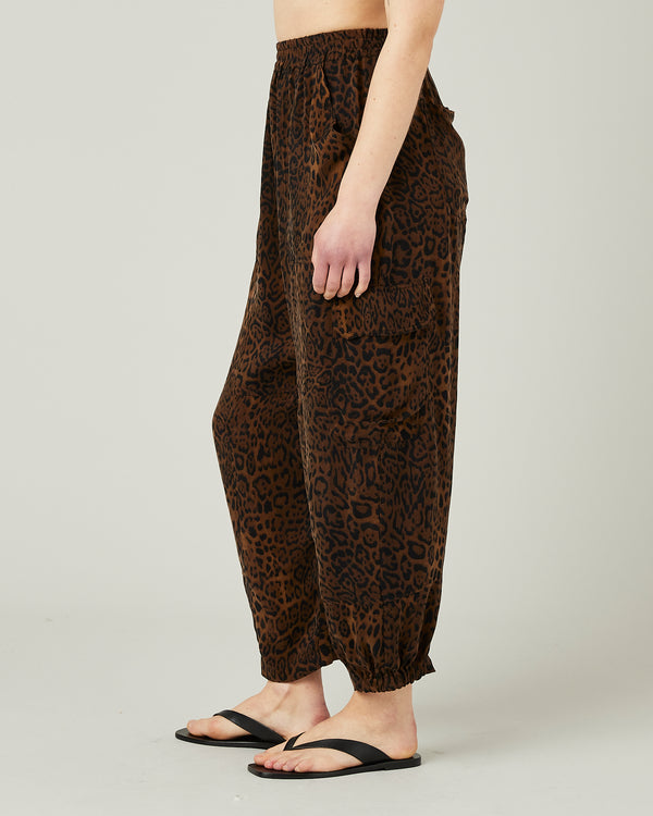 model wears leopard print sylvie cupro trousers left
