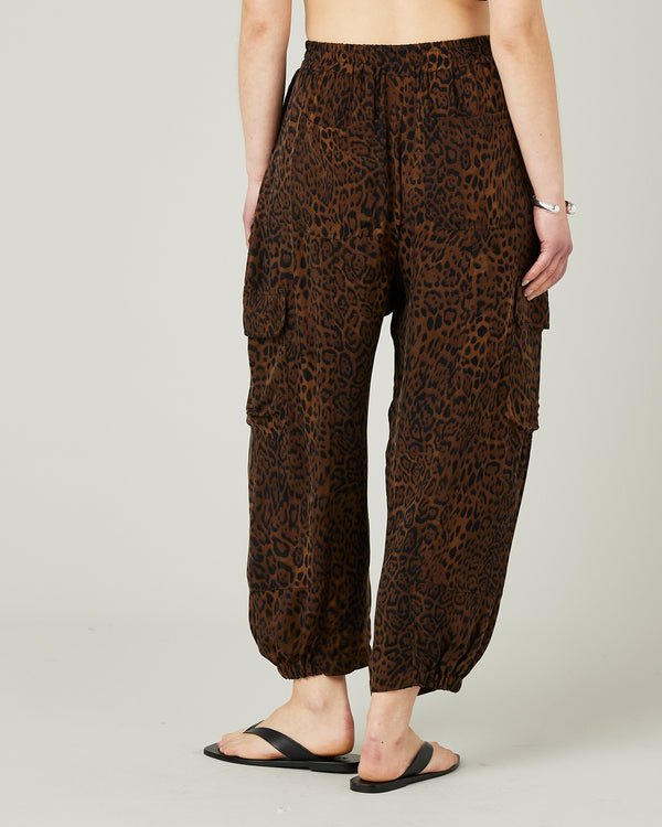 model wears leopard print sylvie cupro trousers back