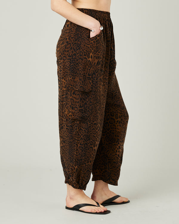 model wears leopard print sylvie cupro trousers right
