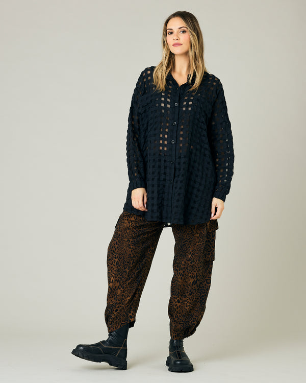 pregnant model wears dark leopard cupro sylvie trousers