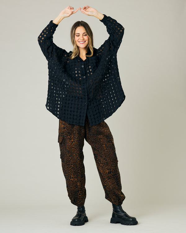 pregnant model wears dark leopard cupro sylvie trousers