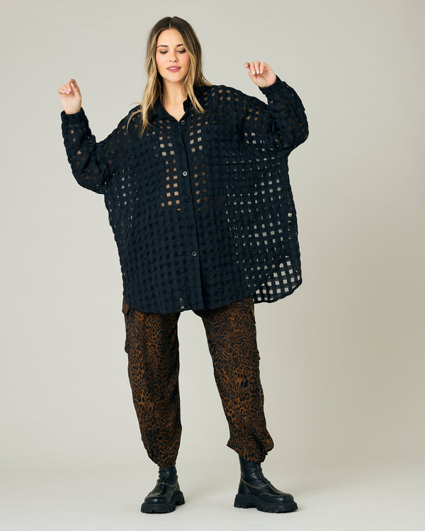 pregnant model wears dark leopard cupro sylvie trousers