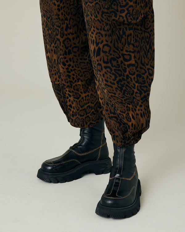 pregnant model wears dark leopard cupro sylvie trousers