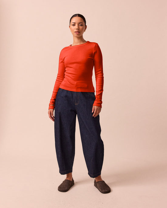 model wears lila red jersey top